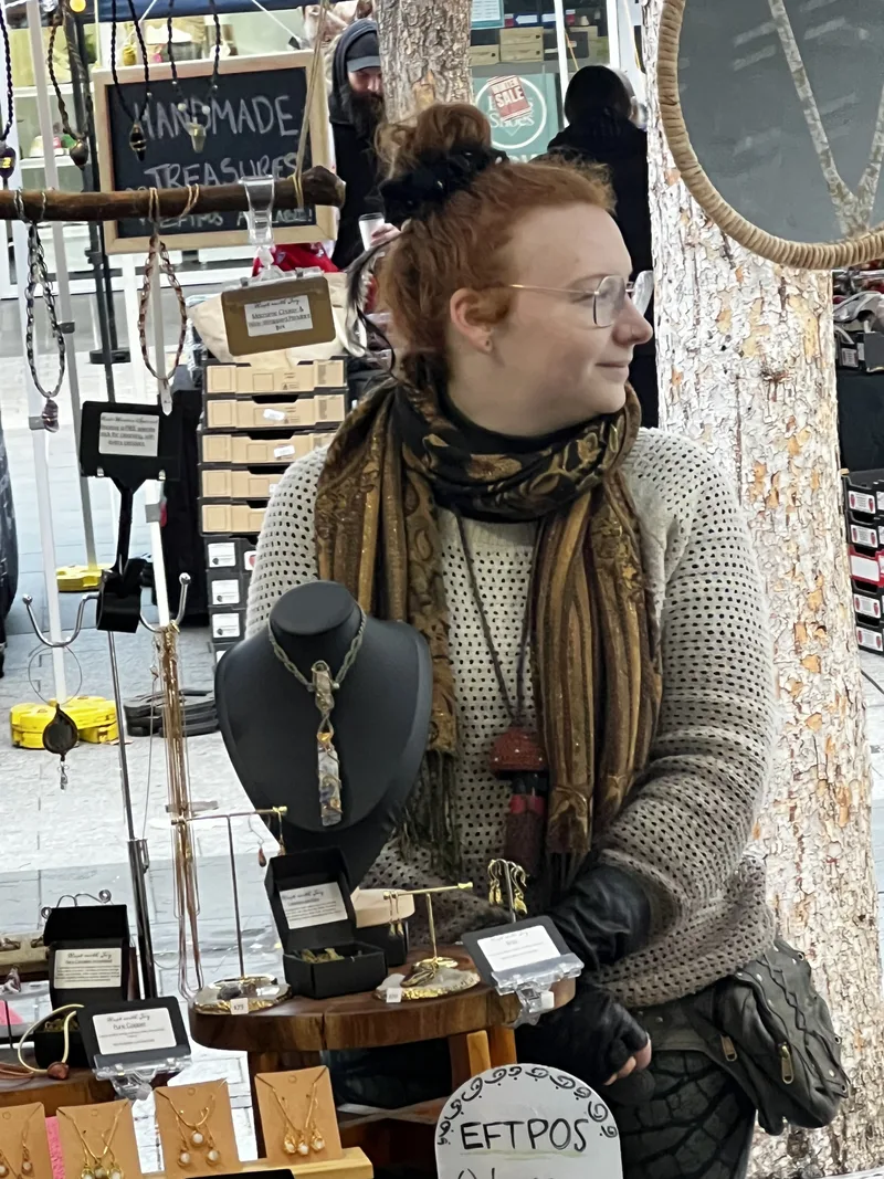 Charlie at the Rapt with Joy jewellery stall with handmade treasures on display.